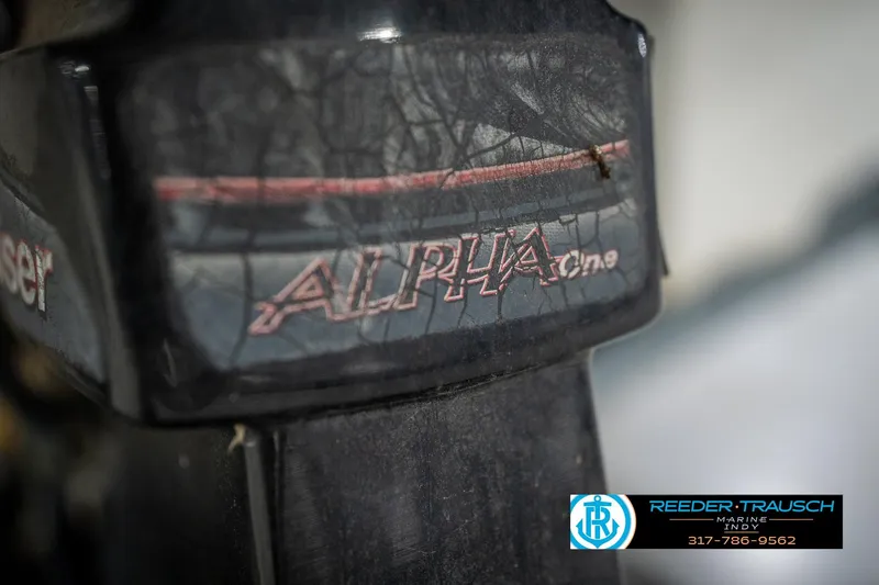Slide: The Image of Close-up of 2005 Sea Ray 200 Sundeck logo on white surface. - 52