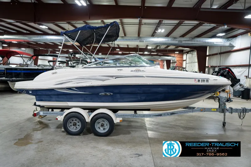 Slide: The Image of 2005 Sea Ray 200 Sundeck boat on trailer in indoor showroom. - 7