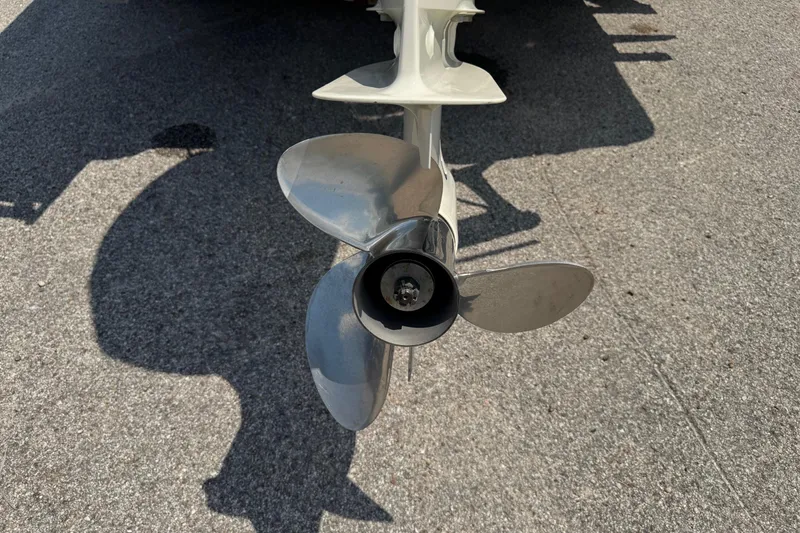 Slide: The Image of Propeller of a 2017 Epic 22 Sport Console boat on pavement. - 10