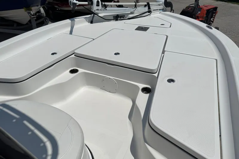 Slide: The Image of 2017 Epic 22 Sport Console boat interior with storage compartments and seating. - 12