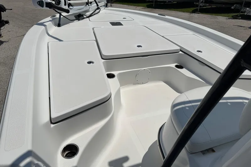 Slide: The Image of 2017 Epic 22 Sport Console boat interior with seating and storage compartments. - 15