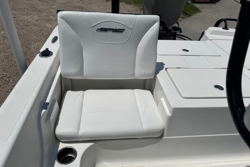 Slide: The Image of White seat on 2017 Epic 22 Sport Console boat, featuring cup holder and storage compartments. - 19