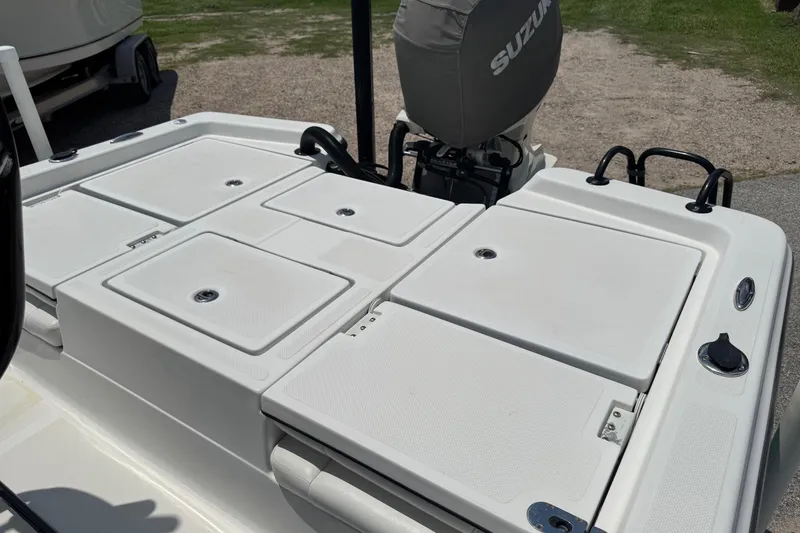 Slide: The Image of 2017 Epic 22 Sport Console boat with Suzuki outboard motor, featuring spacious deck storage. - 20