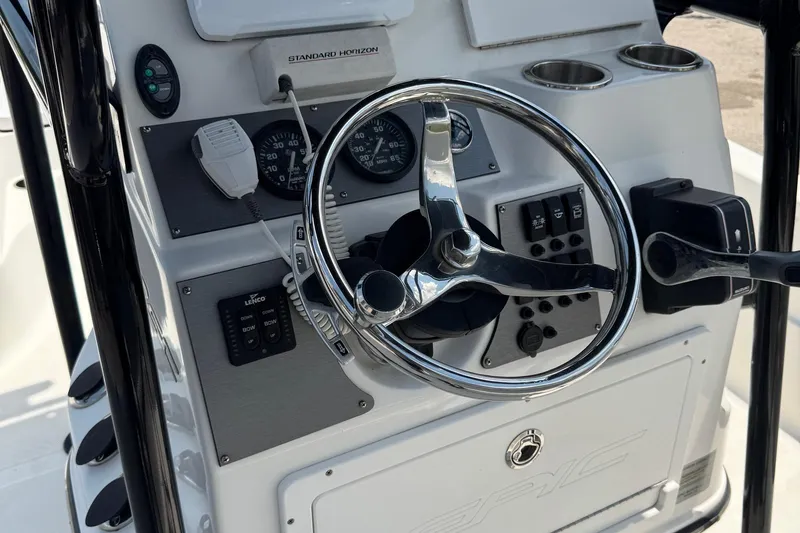 Slide: The Image of Console of 2017 Epic 22 Sport boat with steering wheel and controls. - 22