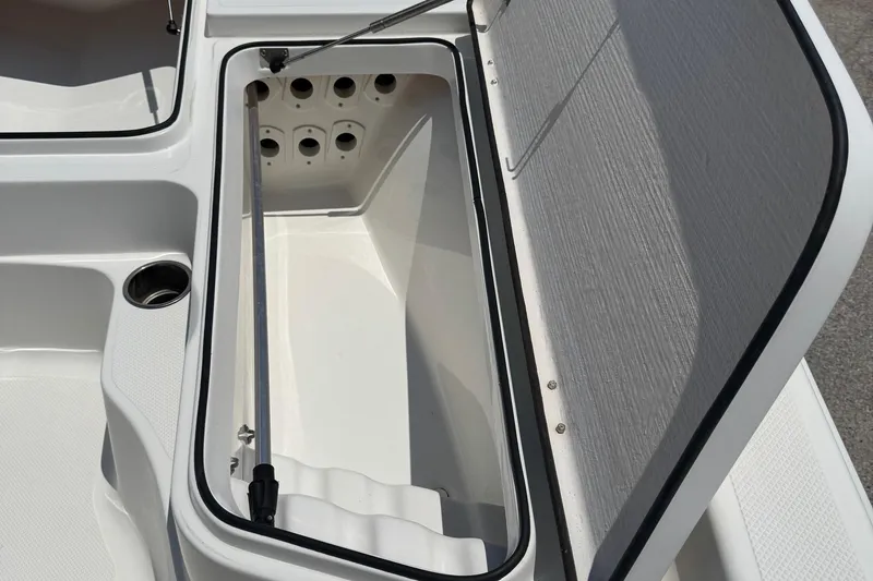 Slide: The Image of Open storage compartment on 2017 Epic 22 Sport Console boat. - 26