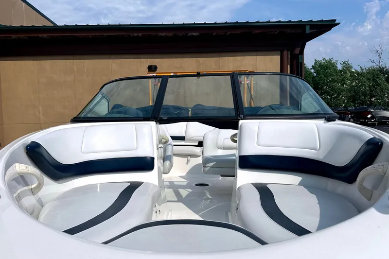Slide: The Image of 2003 Sea-Doo Utopia 185 boat interior with white and blue seating. - 12