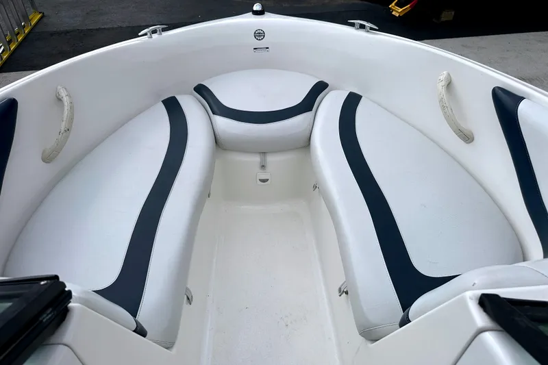 Slide: The Image of 2003 Sea-Doo Utopia 185 boat interior with white and black seating. - 14
