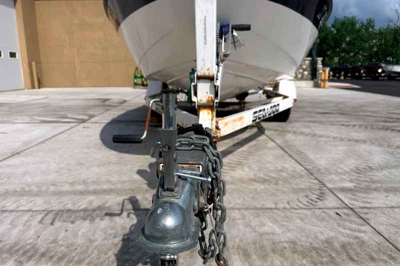 Slide: The Image of 2003 Sea-Doo Utopia 185 boat on trailer, parked on concrete surface. - 21