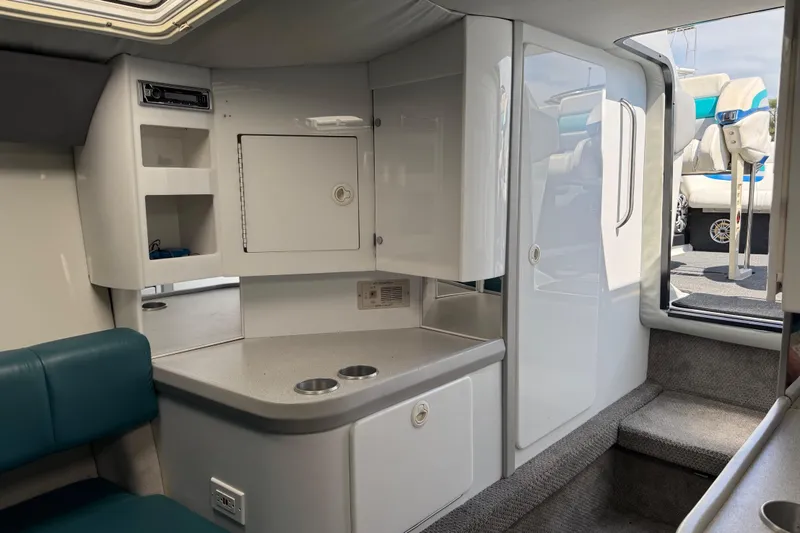 Slide: The Image of Interior of a 1995 Formula 382 SR-1 boat, featuring seating and storage compartments. - 13