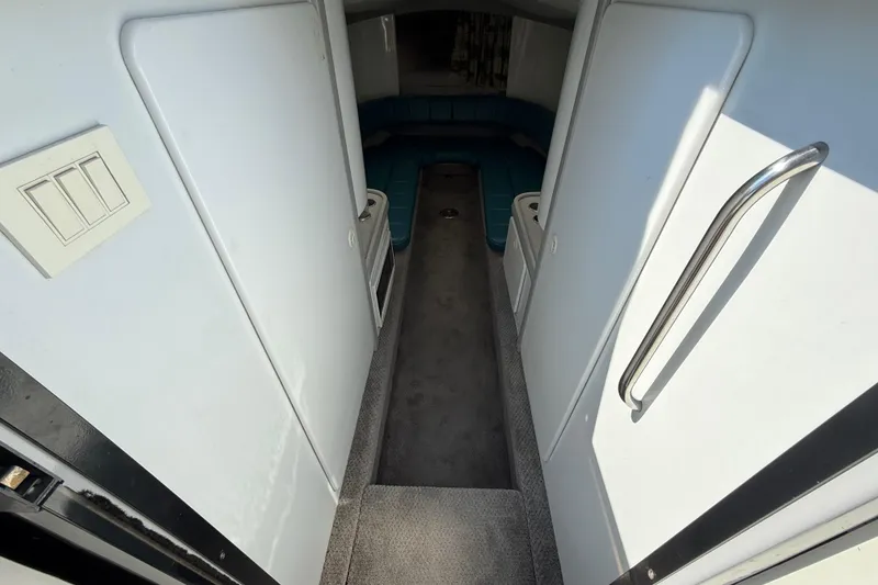 Slide: The Image of Interior view of 1995 Formula 382 SR-1 boat cabin with seating and storage. - 16