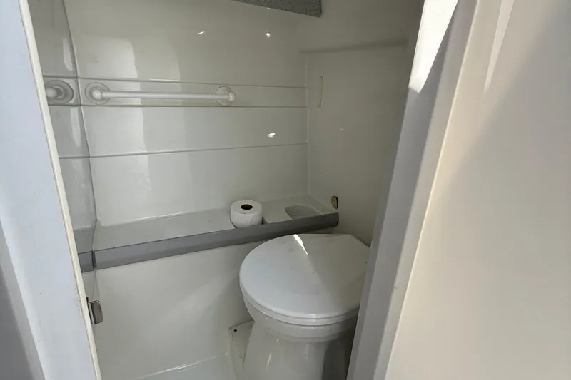 Slide: The Image of 1995 Formula 382 SR-1 boat bathroom interior with toilet and grab bar. - 18