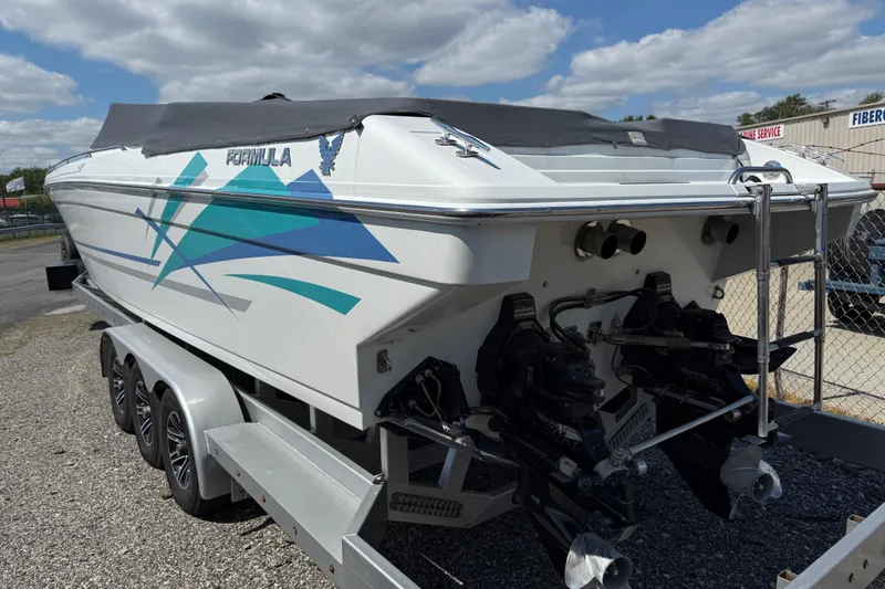Slide: The Image of 1995 Formula 382 SR-1 boat on trailer, featuring sleek design and vibrant graphics. - 2