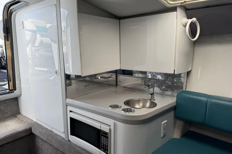 Slide: The Image of Interior of 1995 Formula 382 SR-1 boat with kitchenette, sink, and microwave. - 20