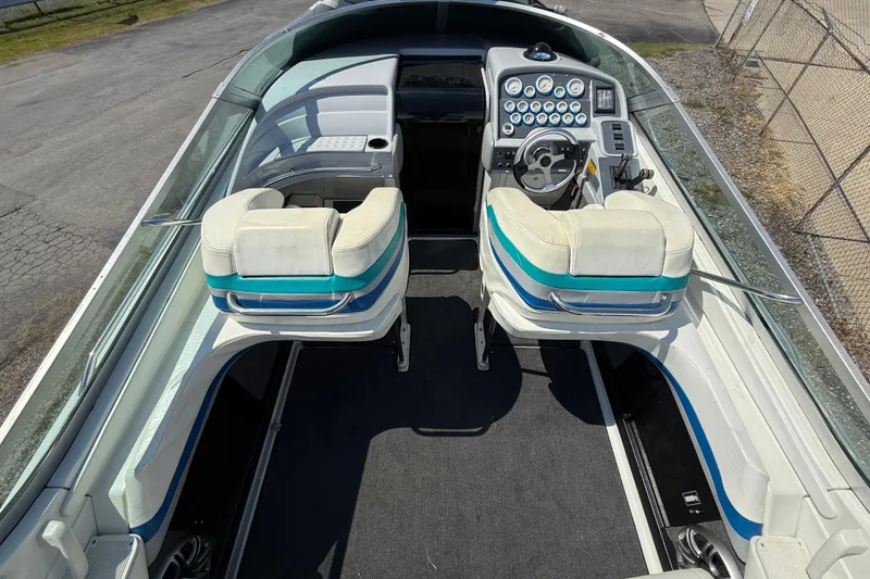 Slide: The Image of 1995 Formula 382 SR-1 boat interior with dual seats and control dashboard. - 25