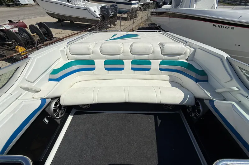 Slide: The Image of 1995 Formula 382 SR-1 boat interior with white and blue seating. - 30