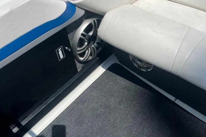 Slide: The Image of Interior of a 1995 Formula 382 SR1 boat, featuring seating and speaker system. - 31