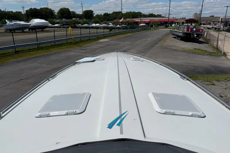 Slide: The Image of 1995 Formula 382 SR-1 boat on trailer at marina, clear sky background. - 35