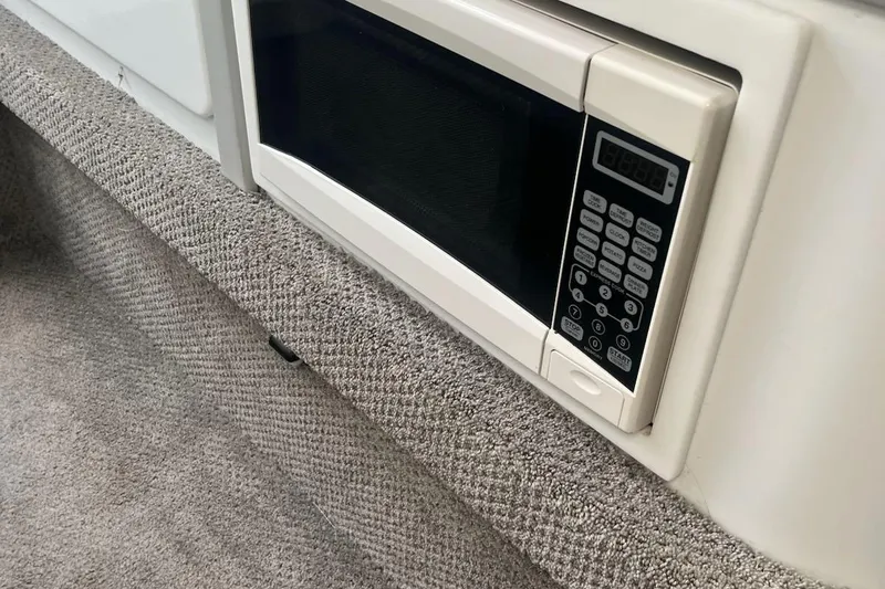Slide: The Image of Built-in microwave in a 1995 Formula 382 SR1 boat interior. - 39