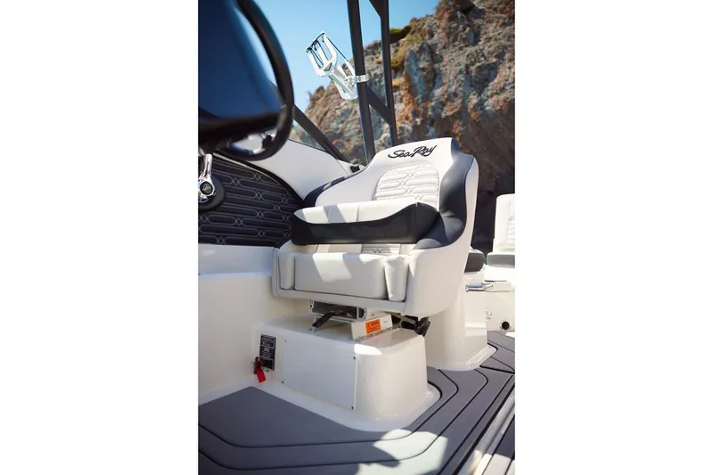 Slide: The Image of 2026 Sea Ray SPX 210 boat with tan deck and seating, viewed from the rear. - 14