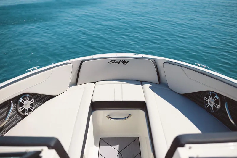 Slide: The Image of 2026 Sea Ray SPX 210 boat interior with tan seating and modern dashboard. - 5