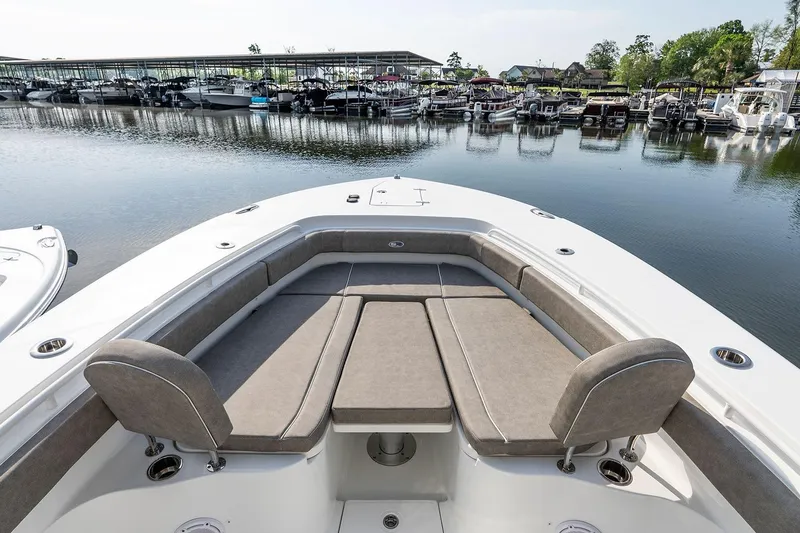 Slide: The Image of 2026 Sea Hunt Ultra 229 boat interior with white seating and modern design. - 11