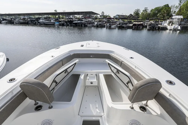 Slide: The Image of 2026 Sea Hunt Ultra 229 boat interior with speakers and lighting at a boat show. - 13