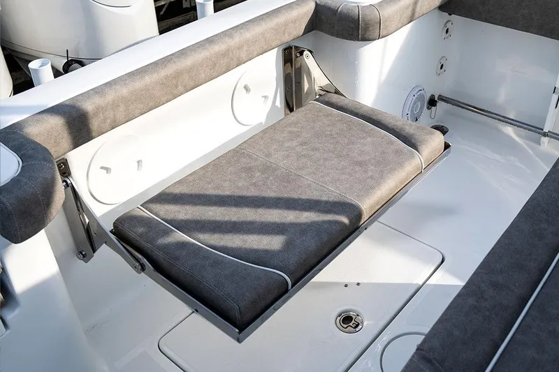 Slide: The Image of 2026 Sea Hunt Ultra 229 boat displayed at an indoor exhibition. - 5