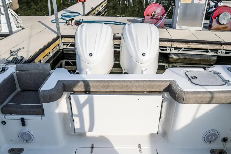 Slide: The Image of 2026 Sea Hunt Ultra 229 boat displayed indoors at a boat show. - 6