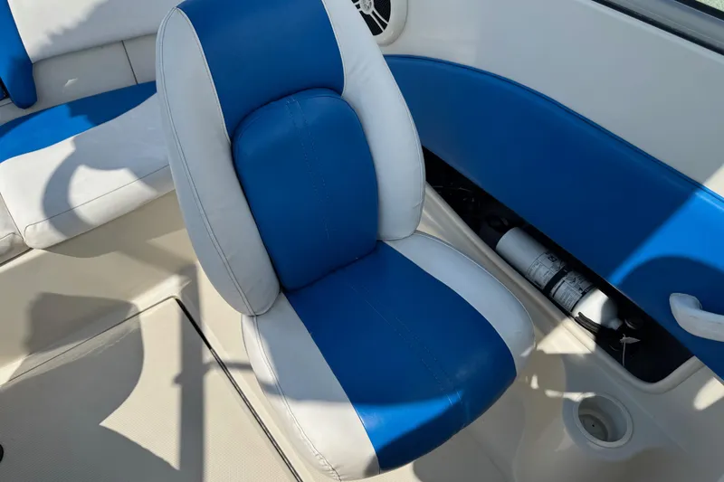 Slide: The Image of 2007 Sea Ray 195 Sport boat interior with blue and white seating. - 13