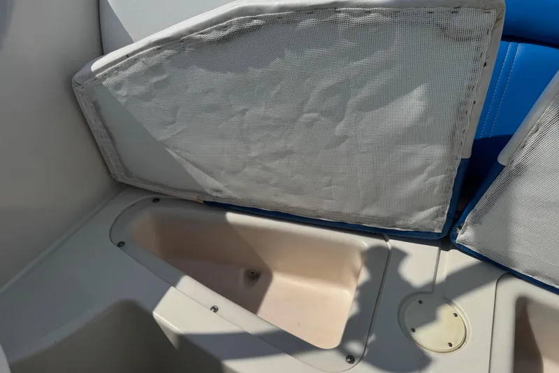 Slide: The Image of 2007 Sea Ray 195 Sport boat interior storage compartment with cushioned seating. - 16