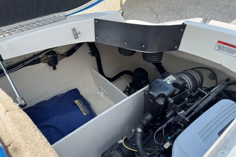 Slide: The Image of Engine compartment of a 2007 Sea Ray 195 Sport boat, showing mechanical components. - 18