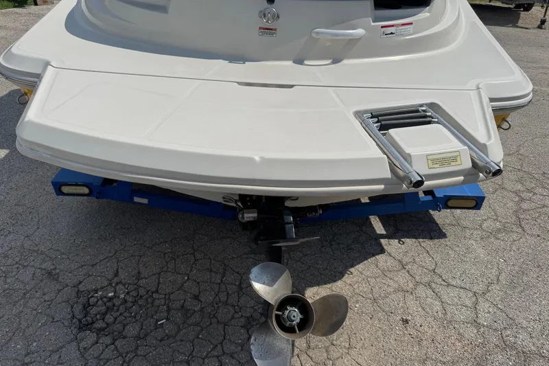 Slide: The Image of Rear view of 2007 Sea Ray 195 Sport boat on trailer, showing propeller and swim platform. - 22