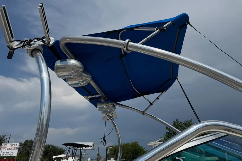 Slide: The Image of 2007 Sea Ray 195 Sport boat with blue canopy and stainless steel frame. - 4