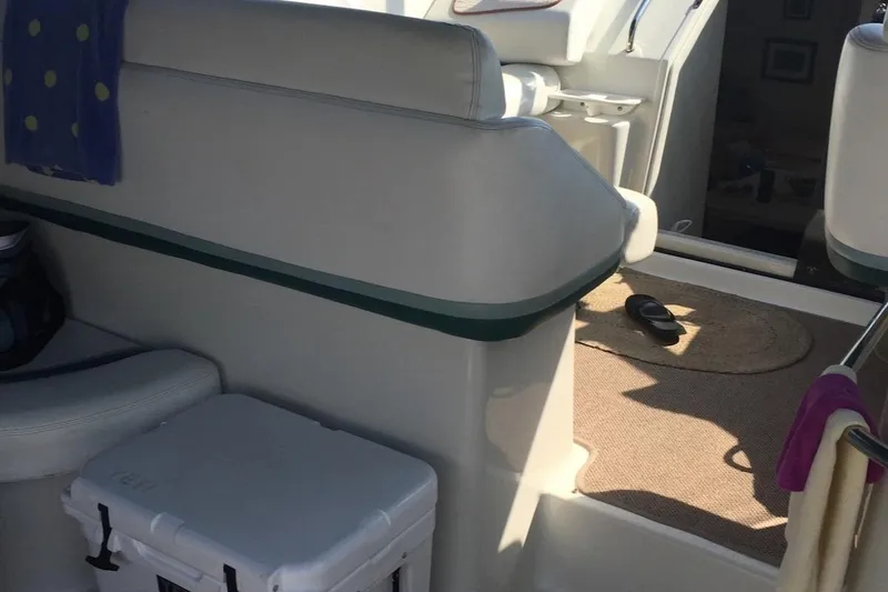 Slide: The Image of Interior of 1993 Silverton 34 Express boat with seating and cooler. - 3