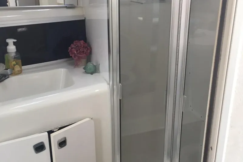 Slide: The Image of Bathroom interior of 1993 Silverton 34 Express yacht with sink and shower. - 9