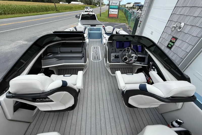 Slide: The Image of 2026 Avalon 2585 Excalibur boat interior with luxurious seating and modern dashboard. - 15