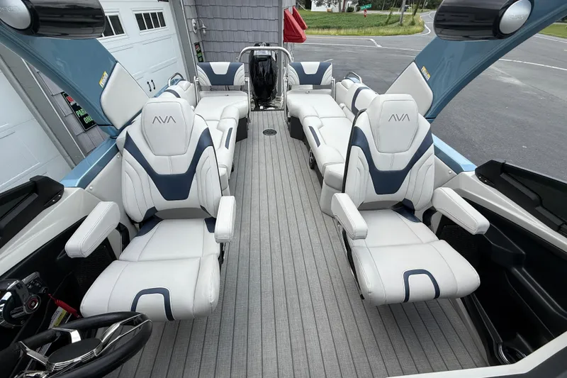 Slide: The Image of Luxurious interior of 2026 Avalon 2585 Excalibur Windshield Quad Lounger with plush seating. - 20