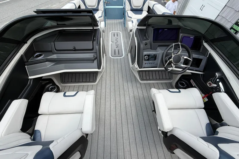 Slide: The Image of Luxurious interior of 2026 Avalon 2585 Excalibur boat with modern dashboard and seating. - 24