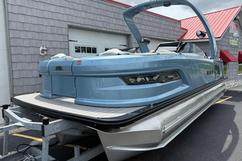 Slide: The Image of 2026 Avalon 2585 Excalibur Tri-toon boat with Mercury 400hp V-10 engine, parked on trailer. - 3