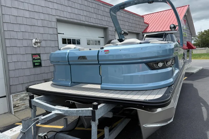 Slide: The Image of 2026 Avalon 2585 Excalibur Tri-toon boat with Mercury 400hp V-10 engine, parked outside. - 4