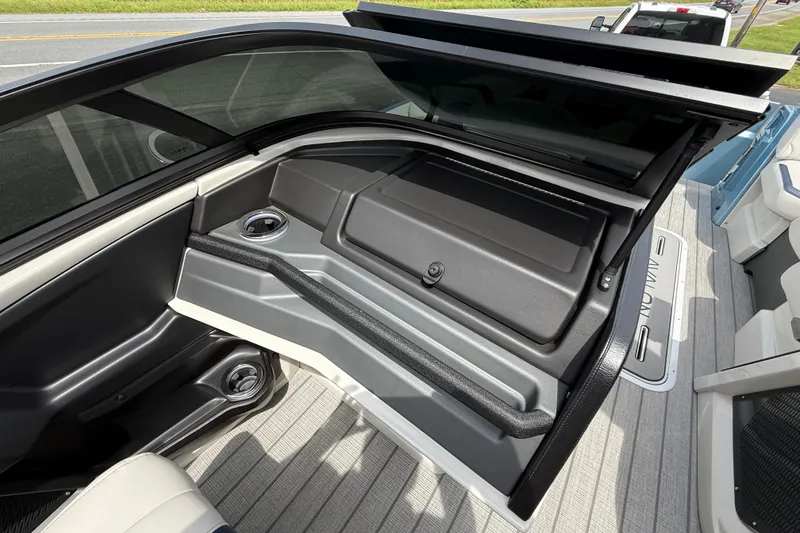 Slide: The Image of 2026 Avalon 2585 Excalibur boat interior with windshield and seating area. - 42