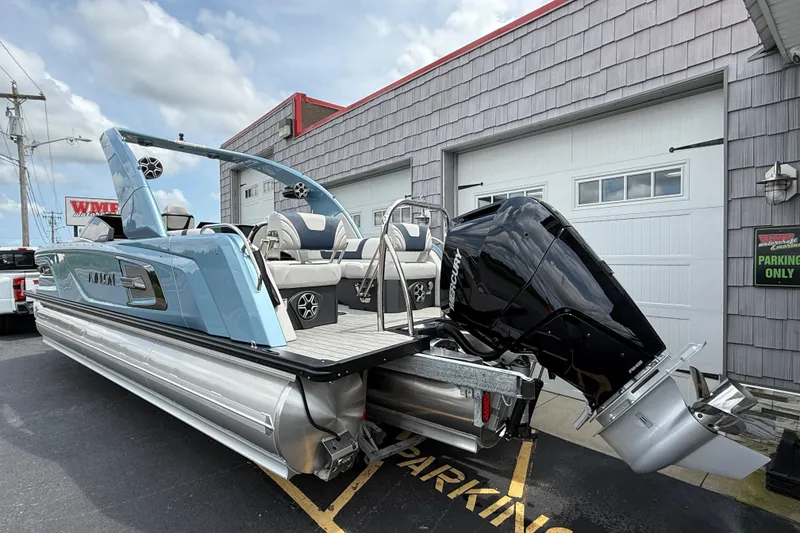 Slide: The Image of 2026 Avalon 2585 Excalibur Tri-toon with Mercury 400hp V-10 engine, parked outside. - 5