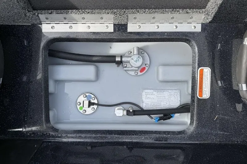 Slide: The Image of Fuel tank compartment of 2026 Nitro Z18 Pro boat, showing hoses and connectors. - 14