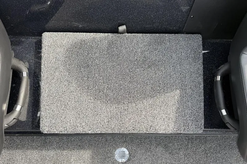 Slide: The Image of Carpeted floor of 2026 Nitro Z18 Pro boat with handles and drain. - 15