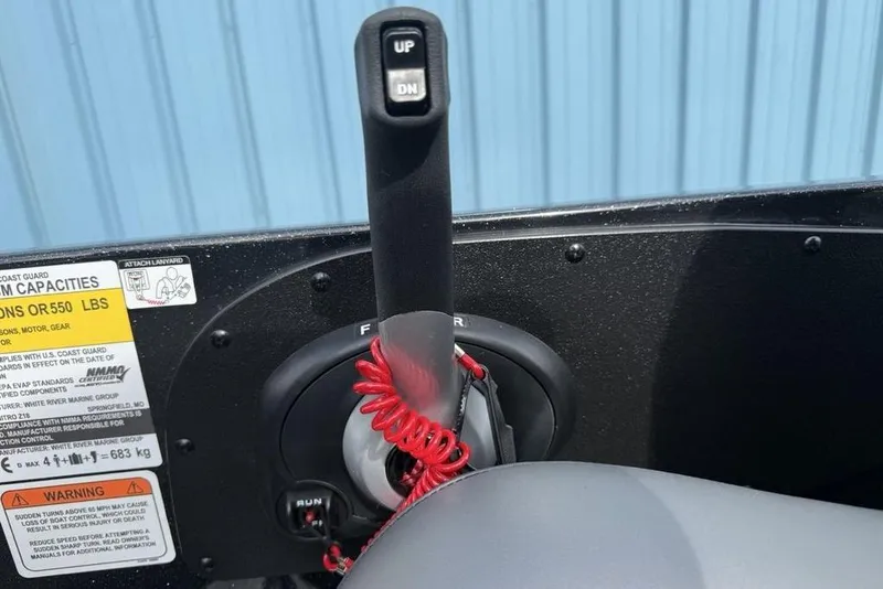 Slide: The Image of Throttle control lever of a 2026 Nitro Z18 Pro boat, featuring safety warnings and capacity labels. - 18