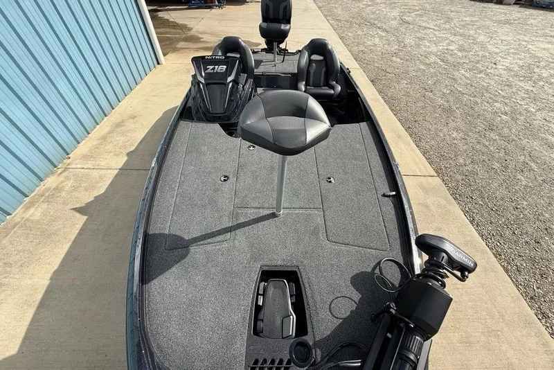 Slide: The Image of 2026 Nitro Z18 Pro fishing boat with seating and equipment on a concrete surface. - 25