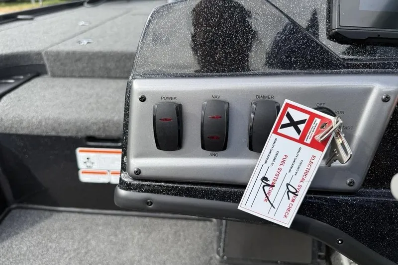 Slide: The Image of Control panel of 2026 Nitro Z18 Pro boat with switches and safety tag. - 8