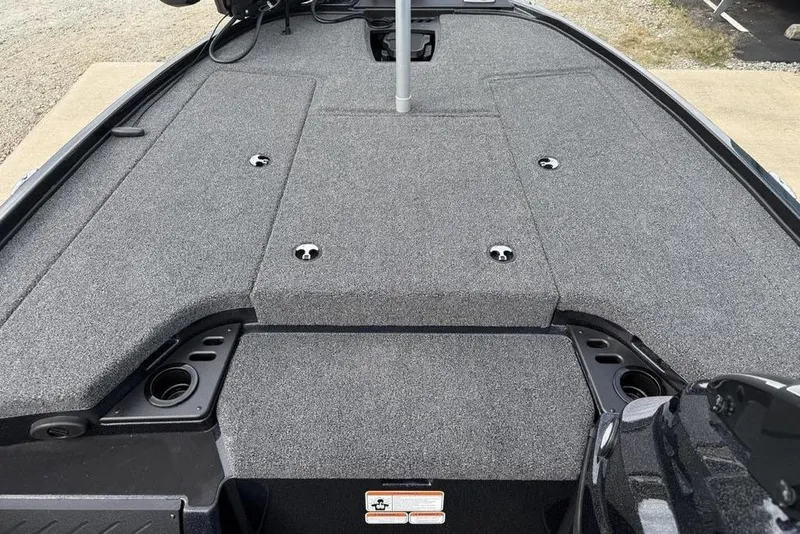 Slide: The Image of 2026 Nitro Z18 Pro boat deck with gray carpet and storage compartments. - 9