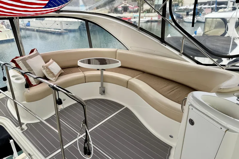 Slide: The Image of Luxurious 2014 Meridian 391 Sedan yacht interior with curved seating and table. - 13