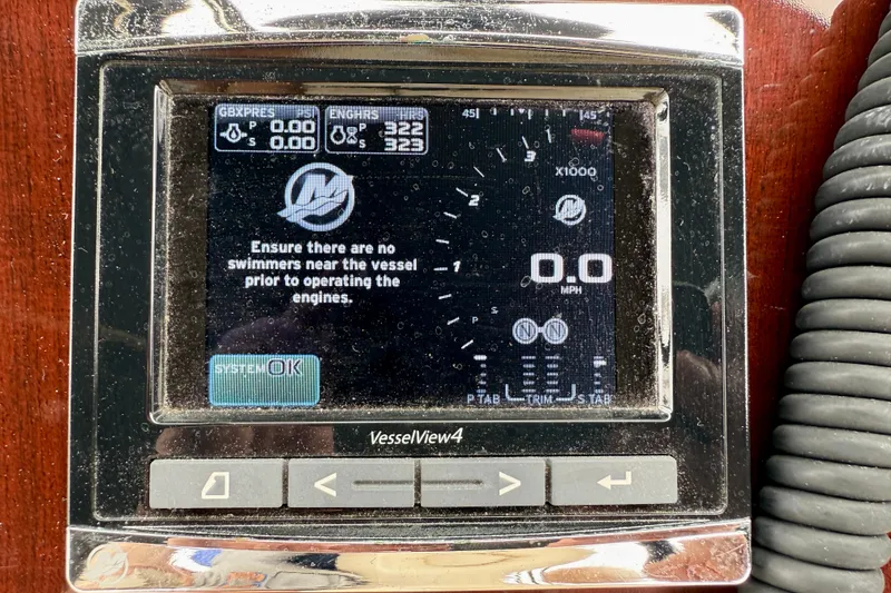 Slide: The Image of Close-up of a 2014 Meridian 391 Sedan VesselView4 display showing engine status and safety warning. - 18
